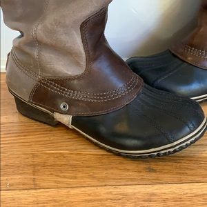 SOREL leather and rubber duck boots.